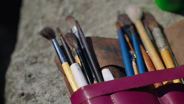 professional painting brushes of artist, closeup shot, drawing tools for hobby