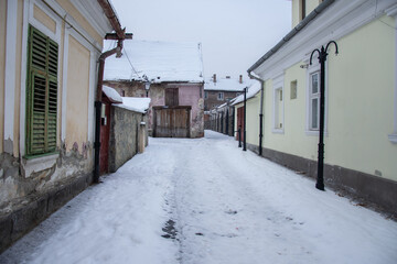 Fototapeta premium Bistrita , january 2022,Romania ,houses on Tiblesului Street 