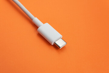 USB cable type C over orange background