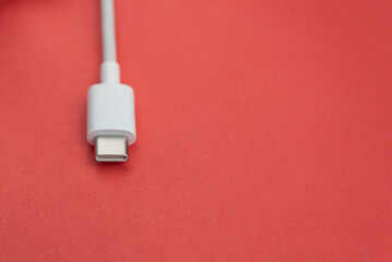 USB cable type C over red background