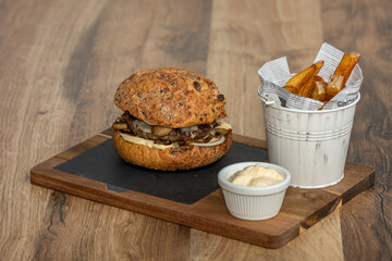 Tasty hamburger with and french fries  melted cheese