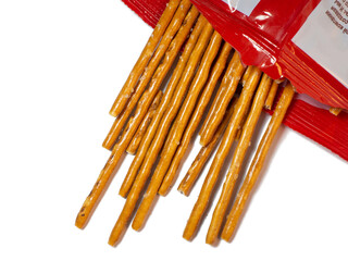 Salted sticks in a package. Confectionery on the table. Salty baked goods.