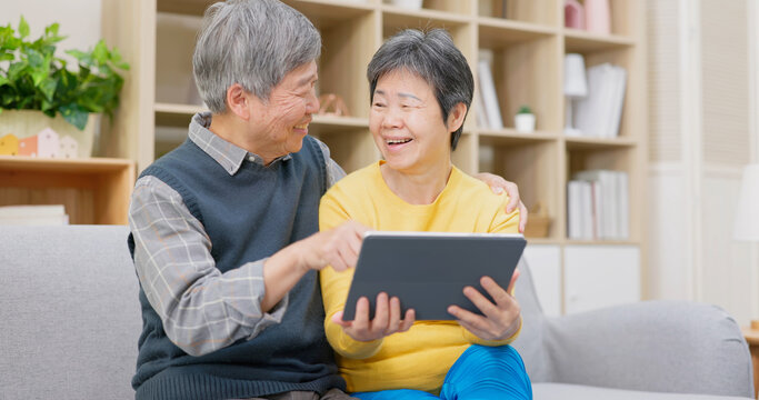 Elderly Couple Use Digital Tablet