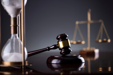 Law symbols composition. Law and justice concept.  Gavel and scale on gray background.