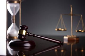 Law symbols composition. Law and justice concept.  Gavel and scale on gray background.
