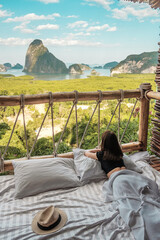 Happy traveler woman enjoy Phang Nga bay view point, Tourists relaxing in tropical resort at Samet...