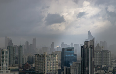 Fototapeta na wymiar Bangkok, thailand - Jan 22, 2022 : Morning scene after rain of various skyscrapers at Bangkok city. Selective focus.