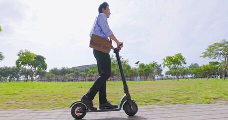 man riding electric scooter © ryanking999