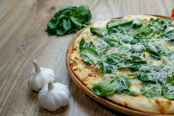 pizza with spinach and mozzarella extra shredded chessee