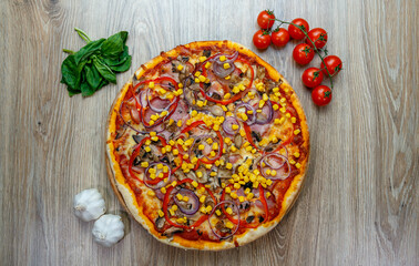 pizza with prosciutto, onion, red pepper, corn, tomato sauce, mushroom and chesse