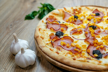 pizza with ham chesse onion corn and truffles