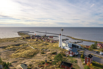 Fototapeta na wymiar Finland, Hailuoto September 26, 2021. Moyak and fishing village Road, view from the top to the coastline. Landscape from a drone on an autumn sunny day. Nature and landscape of Scandinavia