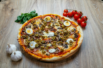 pizza prosciutto e funghi with green olives and boiled egg