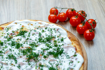 pizza with ham, sour cream, mozarella and dill