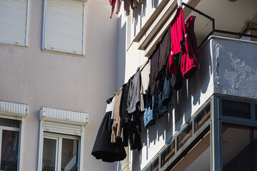 A white house in an turkish  city, laundry is drying on a rope