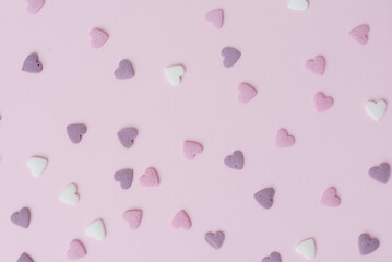 sugar hearts on pink background