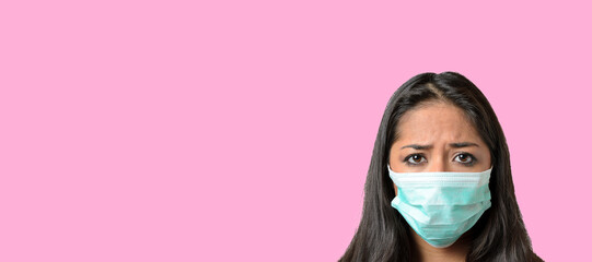 Woman wearing a green medical protective mask against Covid