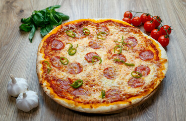 pizza with salami, mozzarella, green hot pepper