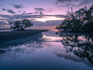 Fototapeta na wymiar Seaside Sunrise Reflections