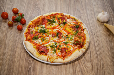pizza with salami mozzarella red pepper corn dill and tomato sauce
