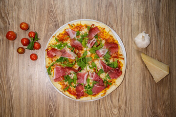 pizza with prosciutto crudo and spinach