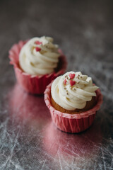 beautiful cupcakes with berries and sprinkles with capsules