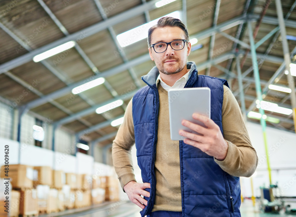 Poster Tracking and tracing your order. Portrait of a man with a digital tablet working in a distribution warehouse.