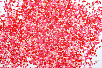 Grajea y chispas para decorar pasteles. Fondo colorido de sprinkles usados para la decoracion de pasteles.