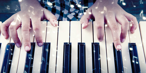 Child pressing keys of a piano with notes symbol