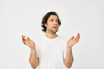 handsome man in white t-shirt fashion cropped view light background