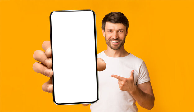 Bearded guy showing white empty smartphone screen, closeup