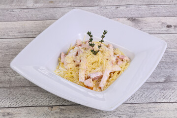Pasta carbonara with ham and cheese
