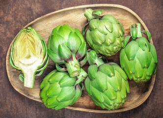 Fresh Artichokes on a wooden  background. Raw Artichok  closeup