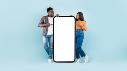 Couple showing blank empty screen for mock up