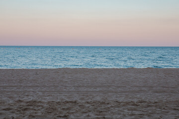 view of dusk time at sandy sea beach