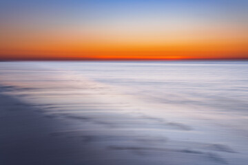 Abstract view of the sunset at the beach on Juist, East Frisian Islands, Germany.