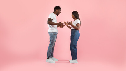 Black couple arguing, woman and man yelling at each other