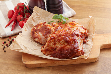 Marinated chicken leg in tomato sauce