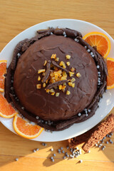 Italian traditional Zuccotto cake made with chocolate sponge cake ,chocolate and orange cream on plate on wooden table