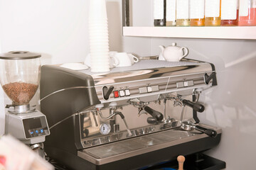 professional coffee machine in italian restaurant. sunny place, good morning, cafe ready for service. coffee making device