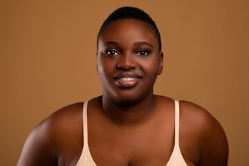 Beautiful plus size African american woman posing at camera