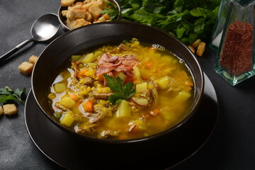 Lentil pea soup garnish with bacon, fried onion and croutons