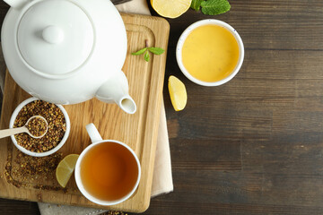 Concept of hot drink with buckwheat tea on wooden table