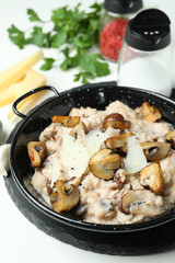 Concept of tasty food with risotto with mushrooms, close up