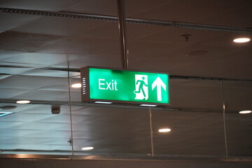 Running Man Sign Emergency Exit. Emergency Fire Exit With Floor. Emergency Exit Sign With Text in...