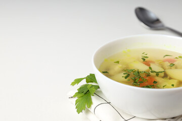 Concept of tasty food with chicken soup on white background