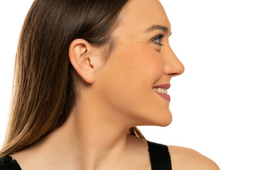 Profile of a young beautiful happy woman with makeup