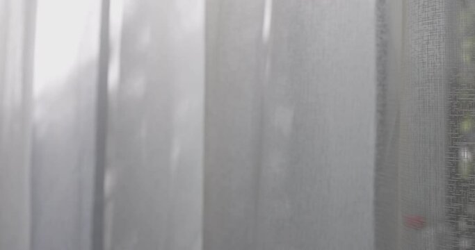 4K video slow motion of curtain in the wind. Concept for cozy and modern residential house.