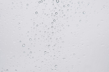 Raindrops on window, bubbles background