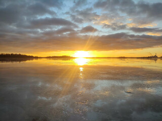 Spectacular sunset over  frozen lake in the Sweden in winter